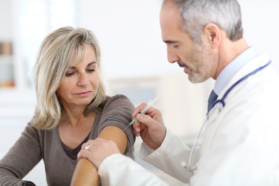 Doctor injecting vaccine to senior woman Monkeypox: What you should know