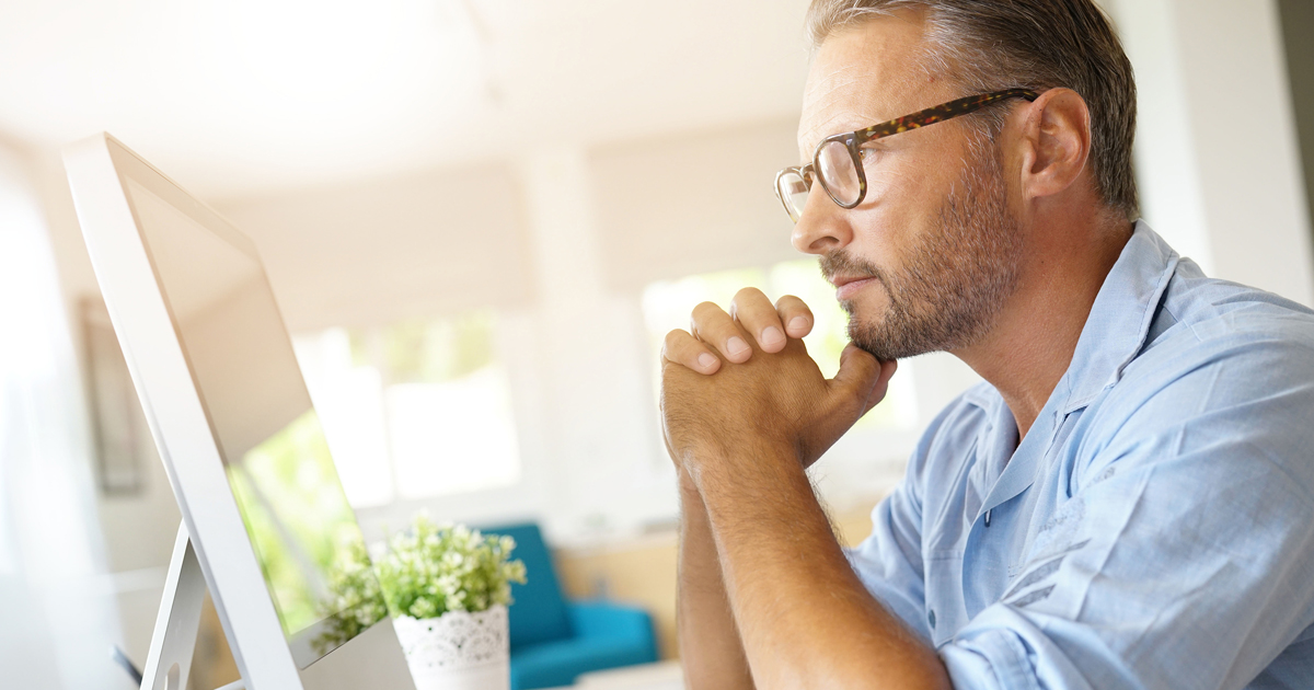 Man searching internet for mental health resources