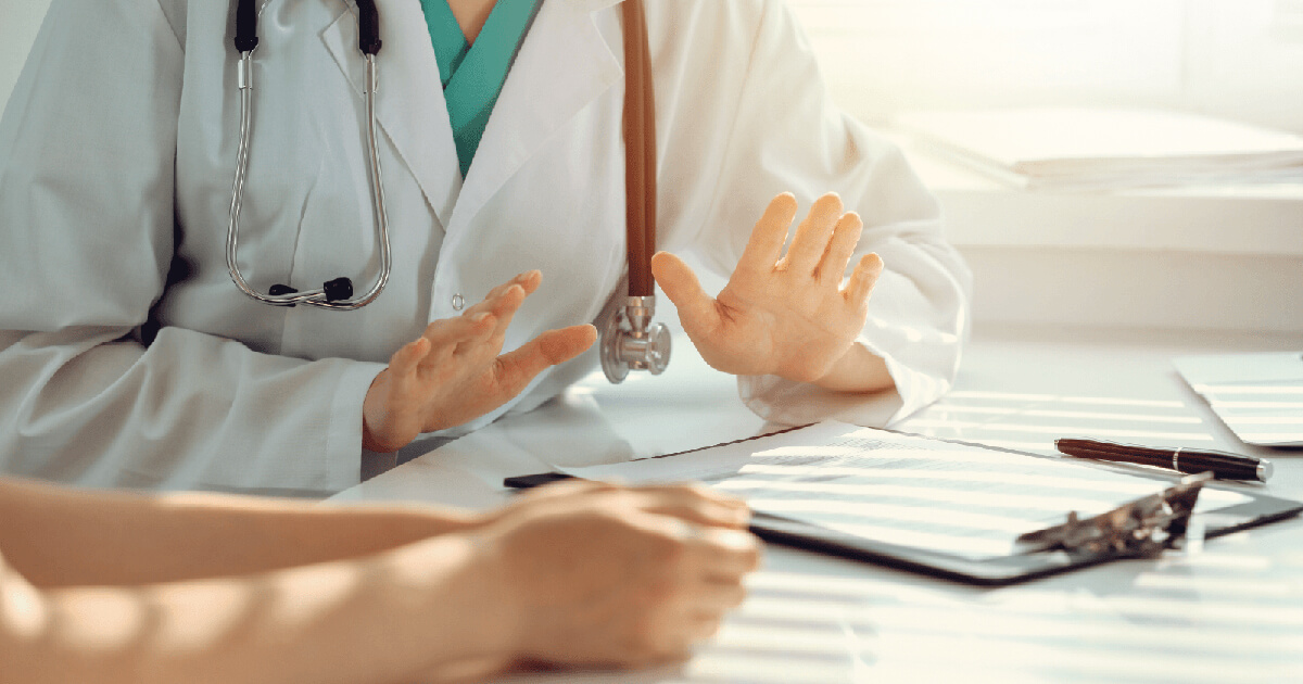 Oncologist explaining Post-Cancer Care Plan