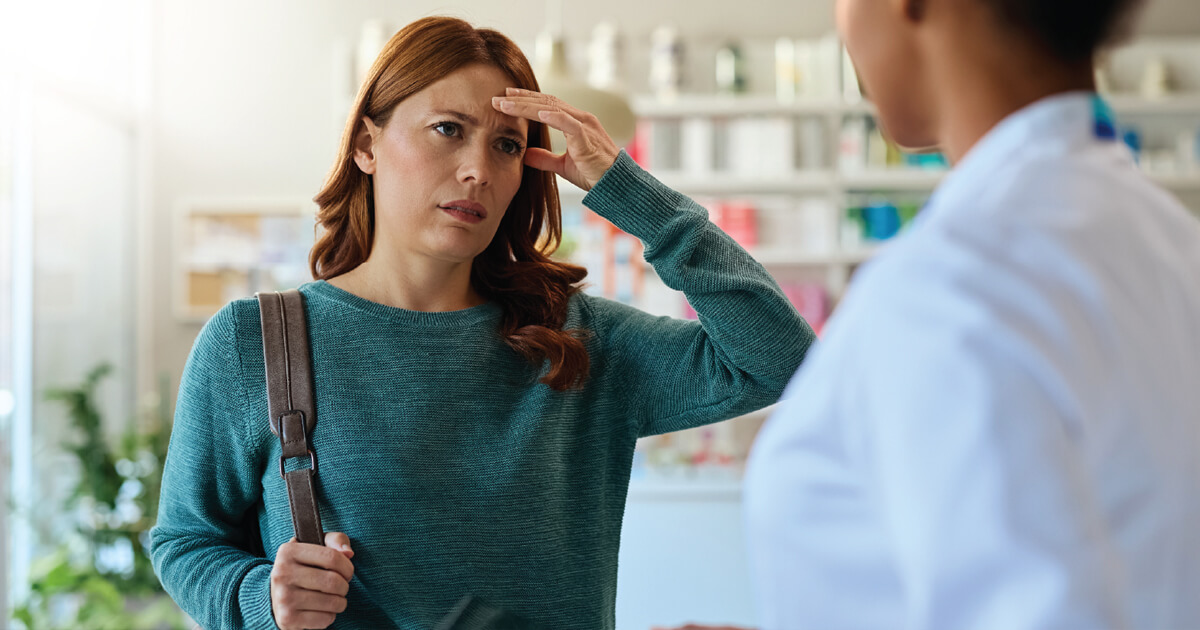 American woman with migraines at doctor